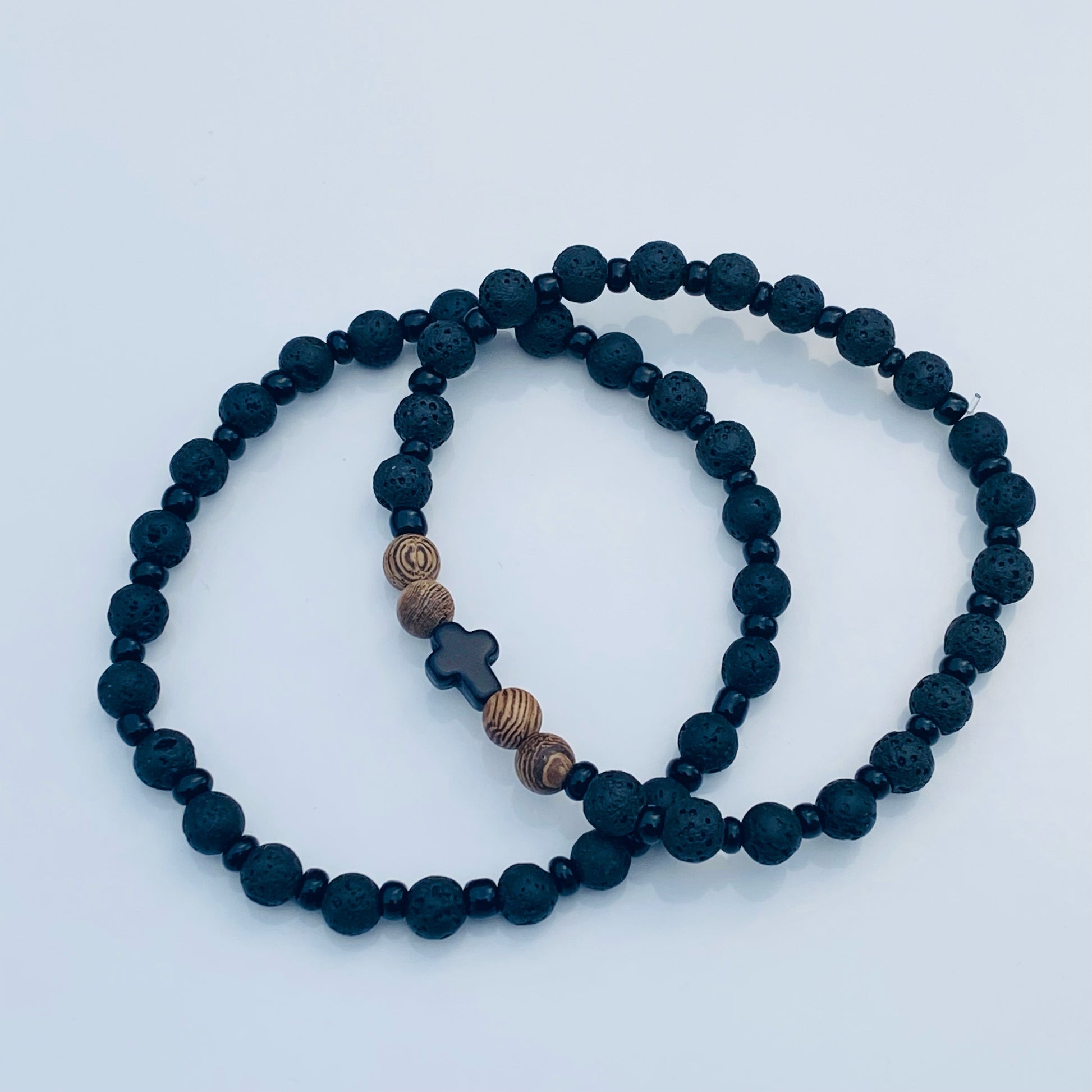 Believe bracelet paired with the Black lava bracelet